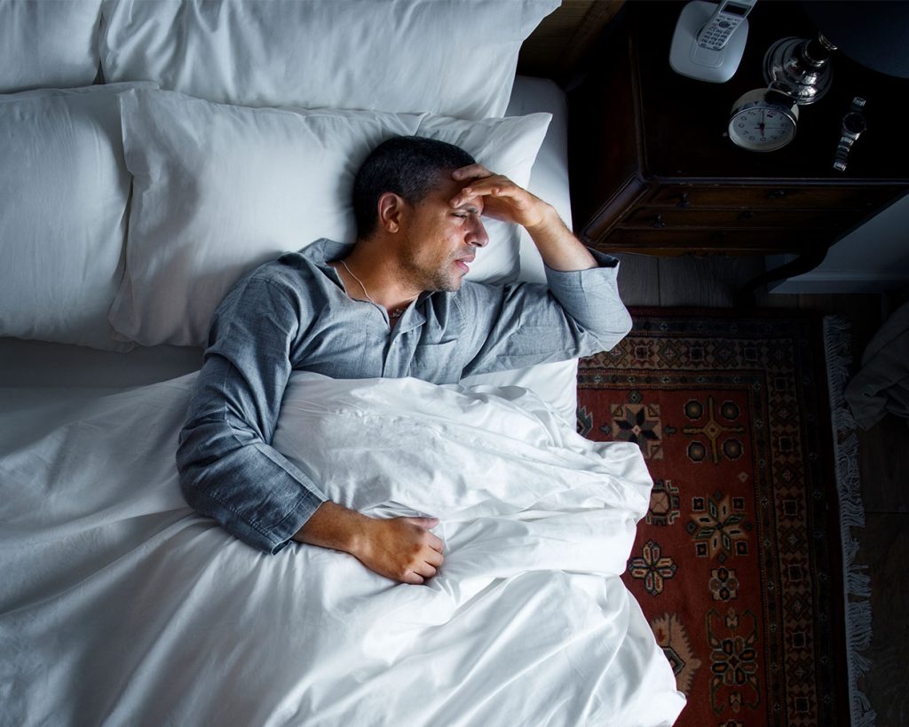 Person sleeping peacefully in a comfortable bed